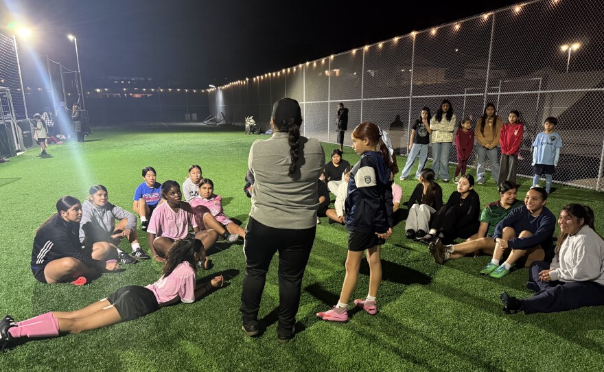 A group of young girls gather on the turf at the new Adam R. Scripps Street Soccer Park in this undated image.
