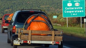 A contender en route to Cooperstown's giant pumpkin weigh-off.