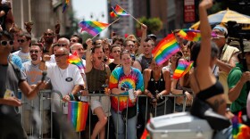 People wave flags during the 2011 NYC LGBT Pride March on the streets of Manhattan on June 26, 2011 in New York City. 