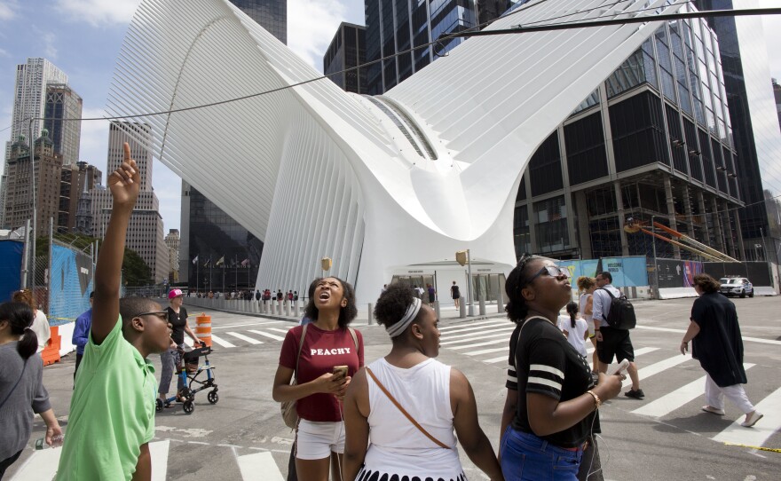 Visitors take in the sights outside the World Trade Center Transportation Hub in New York City.