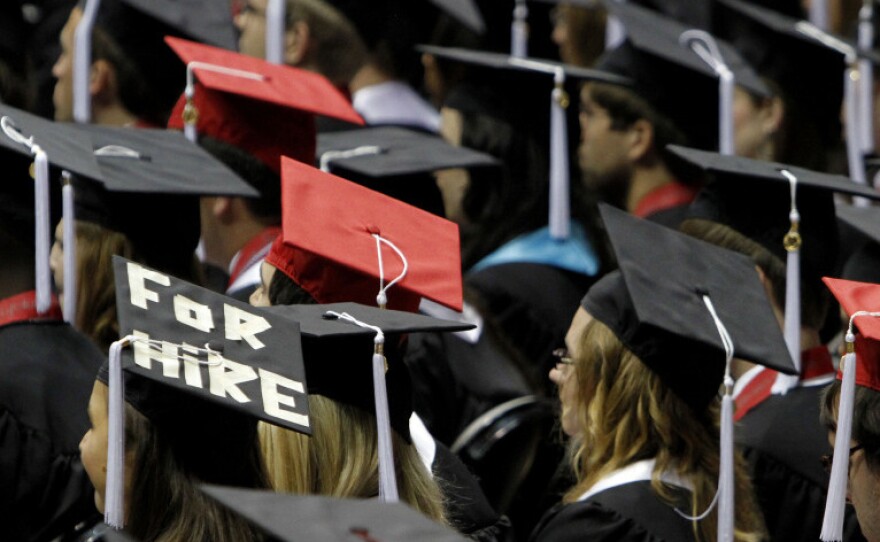 Students attend graduation ceremonies at the University of Alabama in Tuscaloosa, Ala. Two-thirds of college students now graduate with debt, owing an average amount of $24,000.
