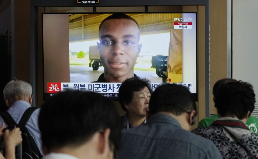 A TV screen shows a file image of U.S. soldier Travis King during a news program at the Seoul Railway Station in Seoul, South Korea, Wednesday, Aug. 16, 2023.