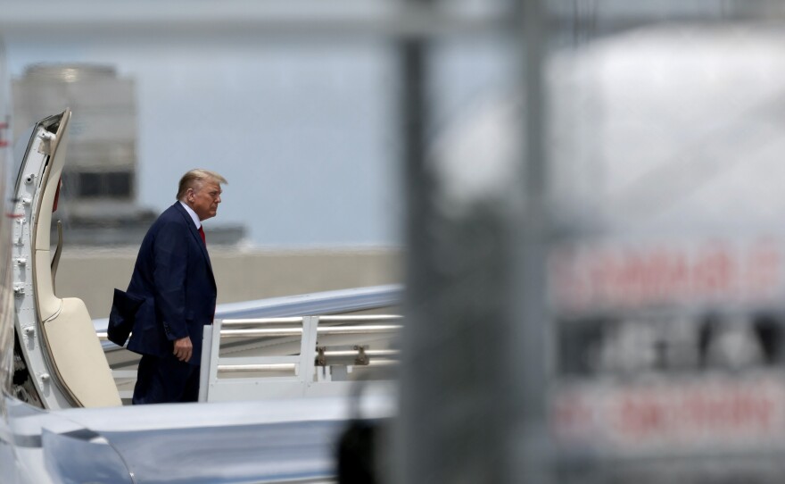 Republican presidential candidate former President Donald Trump arrives at the Miami International Airport on Monday. Trump is scheduled to appear today in federal court for his arraignment on charges including possession of national security documents after leaving office, obstruction and making false statements.