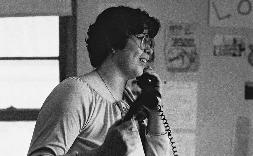 Debbie Cerrillo Curry on the phone in the Love Canal Homeowners Association office.