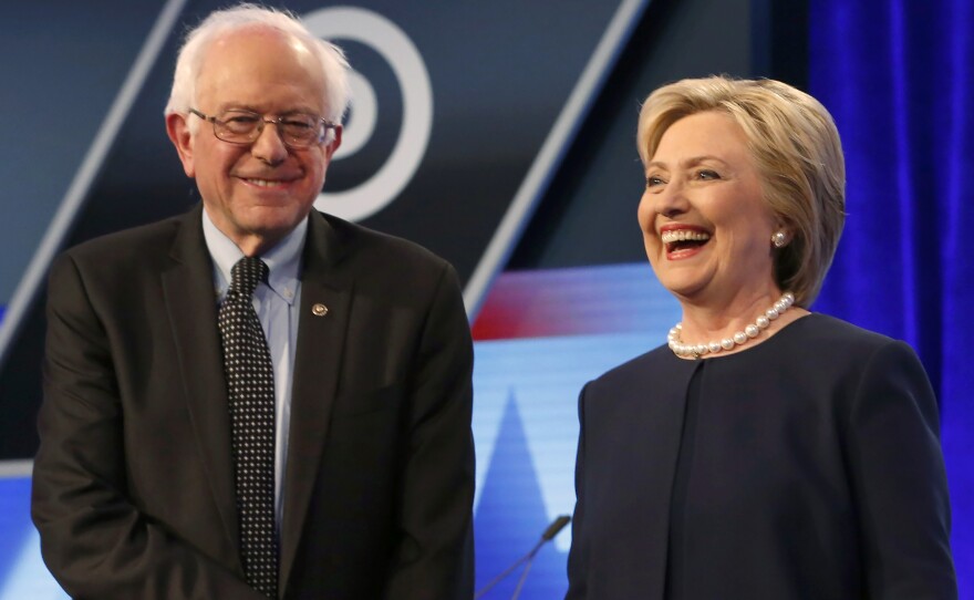 Democratic presidential candidates, Hillary Clinton and Sen. Bernie Sanders shake hands before the start of the Univision, Washington Post Democratic presidential debate at Miami-Dade College on March 9 in Miami, Fla.