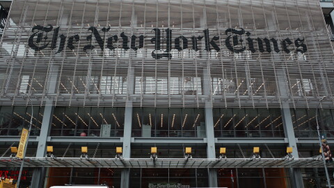 The New York Times says federal agents showed up at several of its journalists' homes Friday night to try to force them to testify before a grand jury next week.