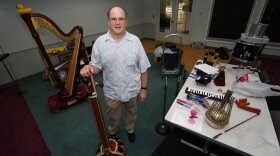 Scott Paulson, surrounded by much of the Teeny-Tiny Pit Orchestra he uses to create the sound effects for the Nancy Drew radio play.