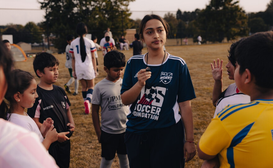 Nirjala Timsina, a coach with ARU's Soccer for Success program, works with a group of young players in Harrisburg, Pa., on Sept. 15, 2025.
