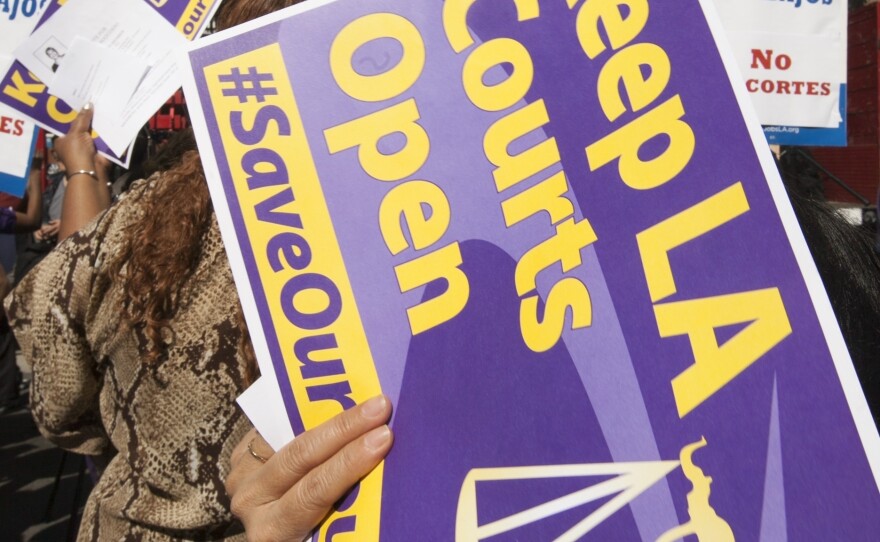 Members of the Save Our Courts coalition rally outside the Los Angeles County Courthouse in March. The county will soon cut the number of courthouses handling small claims cases from 27 to six.