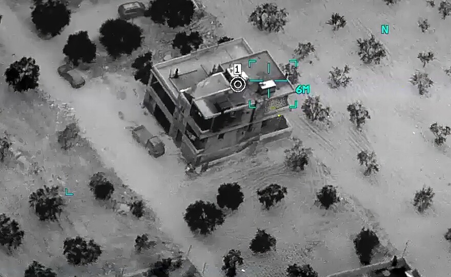 This image from video provided by the Department of Defense and released on Thursday shows the compound where Abu Ibrahim al-Hashimi al-Qurayshi, leader of the Islamic State Group, later died in a raid in Syria's northwestern Idlib province. <em></em>