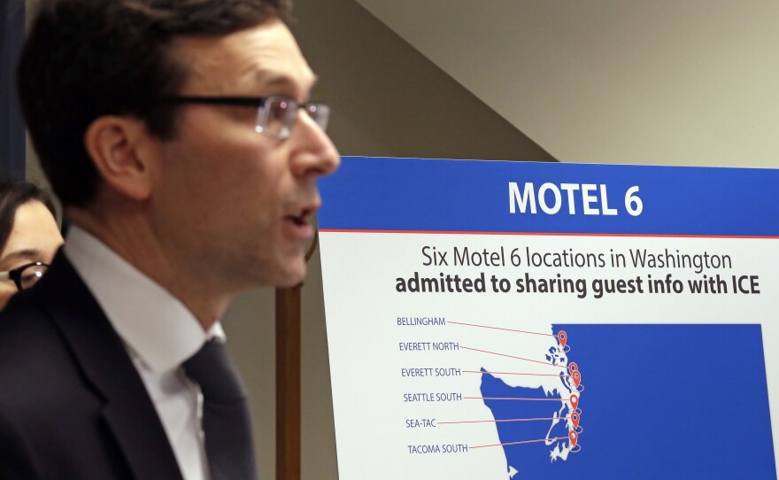 Washington state Attorney General Bob Ferguson addresses a news conference Wednesday in Seattle, announcing that his office is suing Motel 6. Ferguson said that the budget hotel disclosed the personal information of thousands of guests to federal immigration authorities in violation of state law.