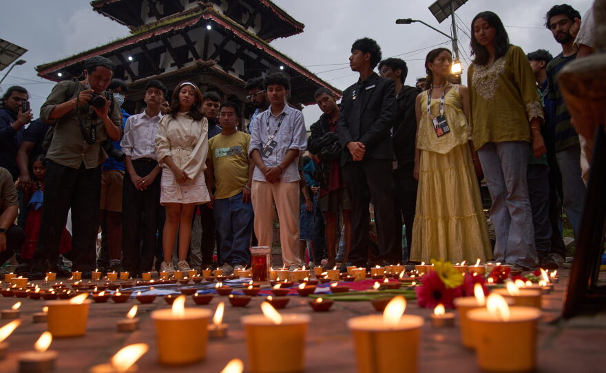 People take part in a candlelight vigil for victims of the floods in Nepal and Tibet, at Durbar Square in Kathmandu, Nepal, Saturday, Sept. 5, 2026.
