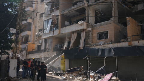 Lebanese security officers gather at the site where an Israeli airstrike hit a building in Dahiyeh, Beirut's southern suburb, Lebanon, Sunday, June 7, 2026.