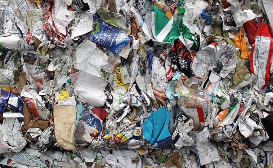 Machines do most of the sorting work at an MRF, with workers doing quality control. Even so, some contaminants make it through the process, like the plastic sandwich bag visible in the bottom right of this paper bale.