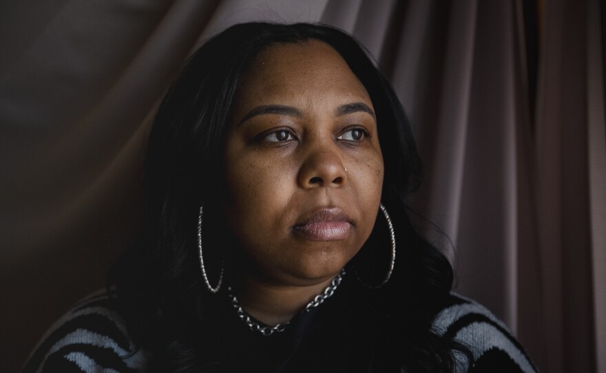 Rashana Greer, 42, sits for a portrait at her childhood home in Philadelphia on Monday, March 25, 2024. Greer lost a nephew in 2020 to gun violence. She decided to move her family out of state because she was afraid of how many homicides there were in Philadelphia.