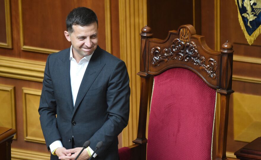 Ukrainian President Volodymyr Zelenskyy greets lawmakers during the solemn opening and first sitting of the new parliament, the Verkhovna Rada, in Kyiv on Aug. 29, 2019.