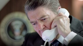 President Ronald Reagan talking on the telephone on Air Force One, 1987.