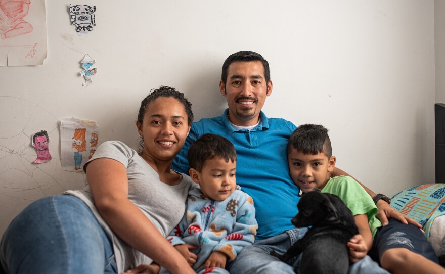 Ferley Sáenz credits the Care School for Men with making him a better dad. Here he poses with his sons, Jeronimo and Martin, and his wife, María Alejandra López.