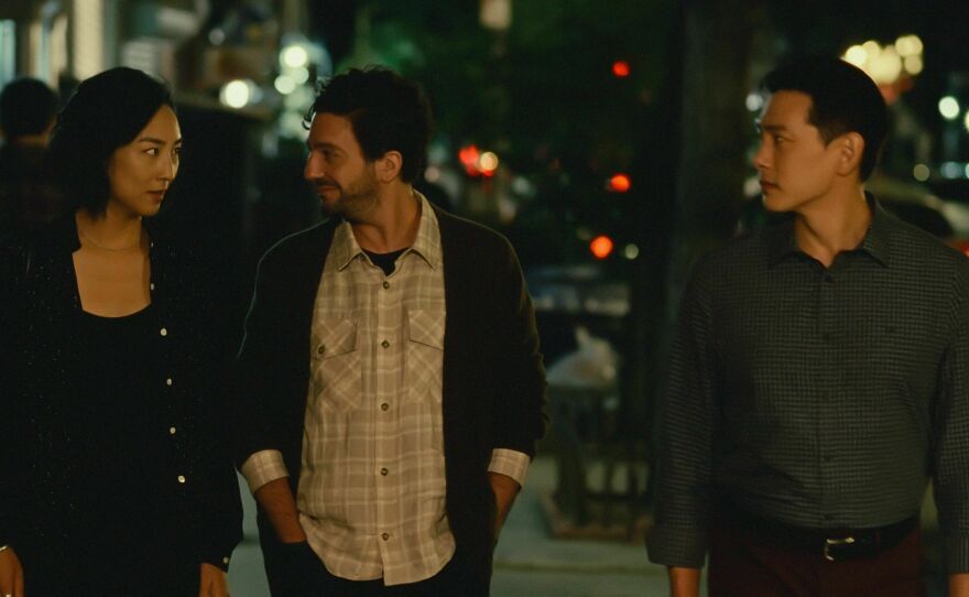 Actors John Magaro and Teo Yoo (shown here with Greta Lee) met for the first time in the scene they shared in <em>Past Lives.</em>