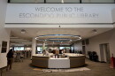 Construction workers finish the welcome desk for the renovated Escondido Public Library, July 14, 2026.
