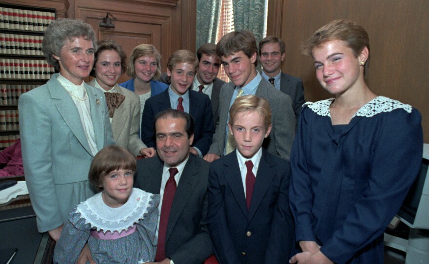 Supreme Court Associate Justice Antonin Scalia poses with his family in his chambers before court ceremonies in 1986 in Washington, D.C. (Front row, from left) Margaret Jane; Justice Scalia, Christopher and Mary. (Back row, from left) Mrs. Scalia, Ann Forrest, Elizabeth, Matthew, Eugene, John and Paul.