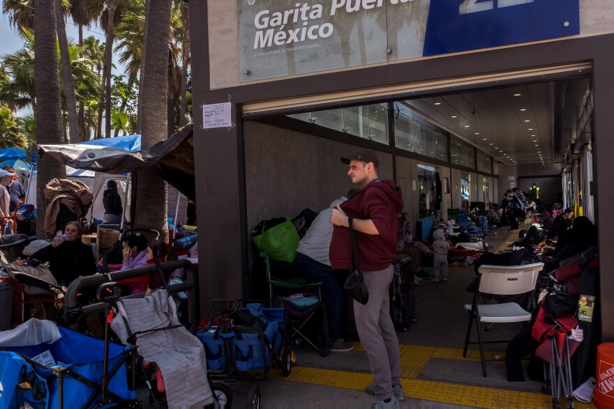 Ukrainian war refugees camp out in a Tijuana bus stop while they wait their turn to claim asylum in the United States, April 4, 2022.