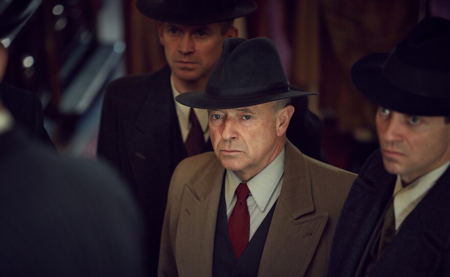 A scene from FOYLE'S WAR. Detective Chief Superintendent Christopher Foyle (Michael Kitchen in center)