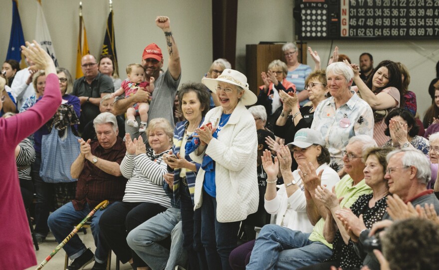 Doris Adams (center) cheers at Warren's campaign stop at the AMVETS veterans post in Chillicothe, Ohio, on May 10. Chillicothe is a rural town in southern Ohio.
