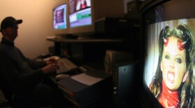 As this photo shows, costumes are often a part of pornographic films. But production studios like Vivid Video, where this movie was being edited, are resisting another piece of wardrobe: condoms.