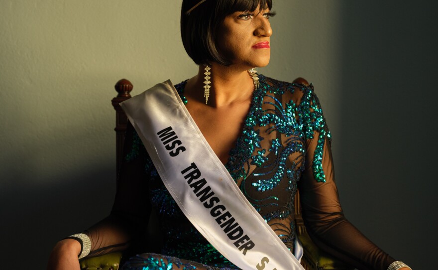 Chedino poses for a portrait in the outfit that she wore when she won Miss Transgender South Africa 2021 at the Governor's Office in the Castle of Good Hope, Cape Town, South Africa, in 2022.
