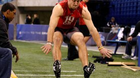 <strong>Looking For A Spot:</strong> Quarterback Tim Tebow performs the long jump at the NFL Scouting Combine. It remains to be seen where — or if — Tebow might land in the big leagues.