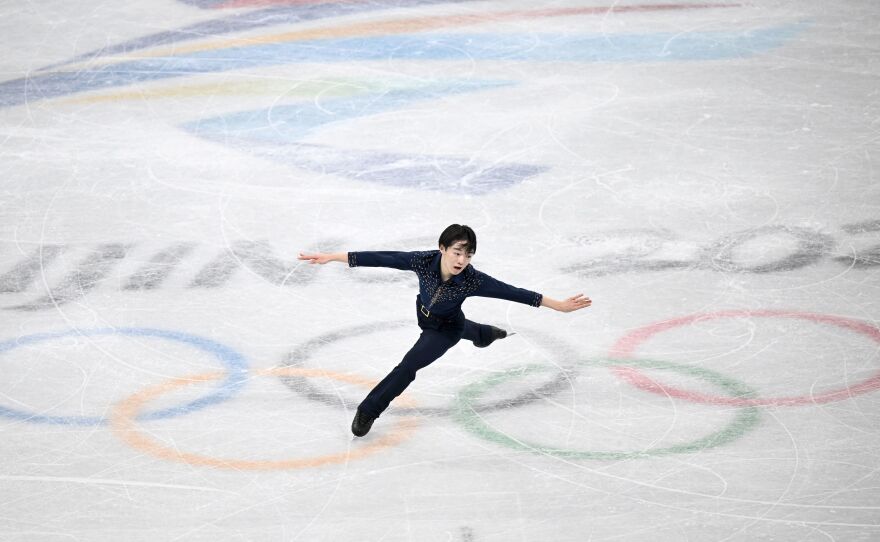 Japan's Yuma Kagiyama competes in the men's single skating short program of the figure skating event during the Beijing 2022 Winter Olympic Games. He came in second place.