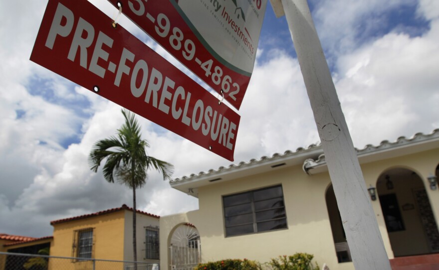 A sign hangs outside a house in Miami in 2010. Currently, Florida's foreclosure legal process can take a couple of years, which critics say is hurting the housing market.