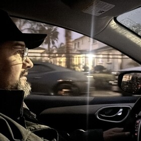 Benjamin Prado, an immigrant rights activist with Union del Barrio, drives around Linda Vista Friday, Feb. 7, 2025.