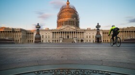 A cyclist rides across the front plaza of the U.S. Capitol, Nov. 4, 2014.
