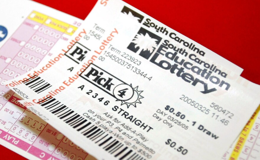 The South Carolina Education Lottery says a programming error in its computer system vendor is to blame for a profusion of winning tickets on Christmas. Two of the state's lottery tickets are pictured here in 2005.