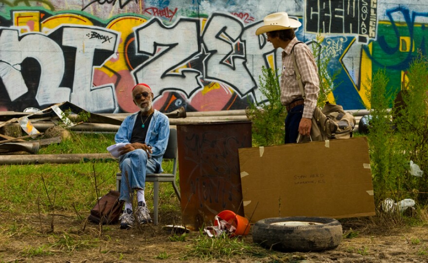 Crop artis Stan Herd (played by John Hawkes) enlists the help of homeless people to create his crop art in "Earthwork."