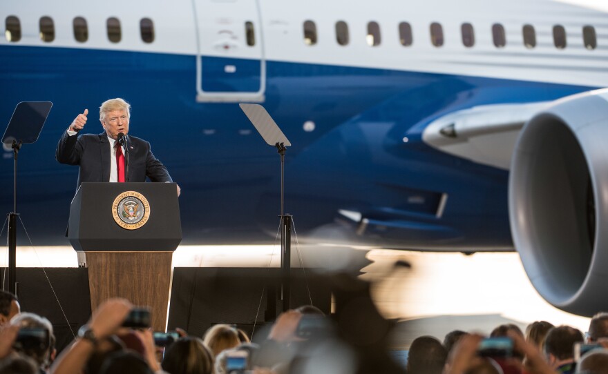 President Trump addresses a crowd during the debut of the new Dreamliner 787 at Boeing's South Carolina facilities on Feb. 17 in North Charleston. Trump uses Boeing as an example of his "America First" policies, but the plane parts come from all over.