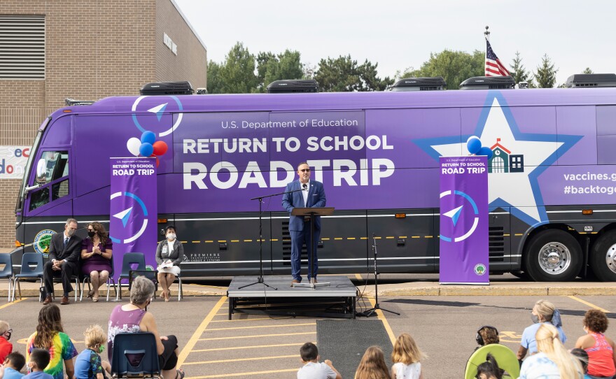 Cardona addresses students and staff during the Locust Lane pep rally. Eau Claire was the first stop of the secretary's "Return-to-School Road Trip," which took him to five Midwestern states this week in a lush, purple bus.