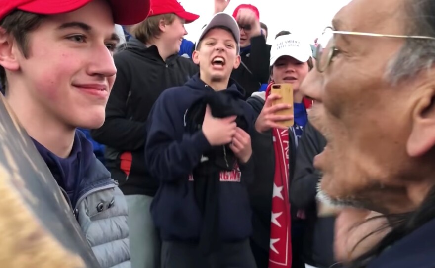 Nick Sandmann, a student from Covington Catholic High School, stands in front of Nathan Phillips, a Native American, at the Lincoln Memorial in Washington, D.C.