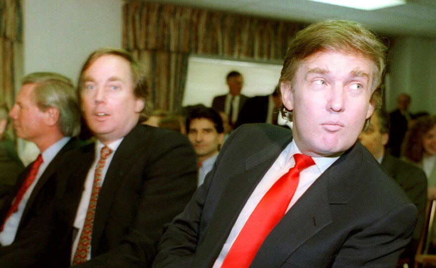 Donald Trump (right) waits with his brother Robert for the start of a Casino Control Commission meeting in Atlantic City, N.J., on March 29, 1990. Trump was seeking final approval for the Taj Mahal Casino and Hotel.