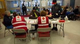 Red Cross volunteers register New Jersey residents at a shelter in Pleasantville.