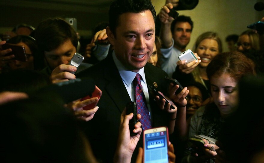 Rep. Jason Chaffetz is surrounded by members of the media as he leaves a closed House Republican election meeting where Rep. Kevin McCarthy withdrew from the race.