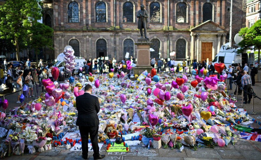 Flowers and tributes were left in Manchester's St. Ann's Square honoring the memories of those who died in May's terrorist attack at the Manchester Arena.