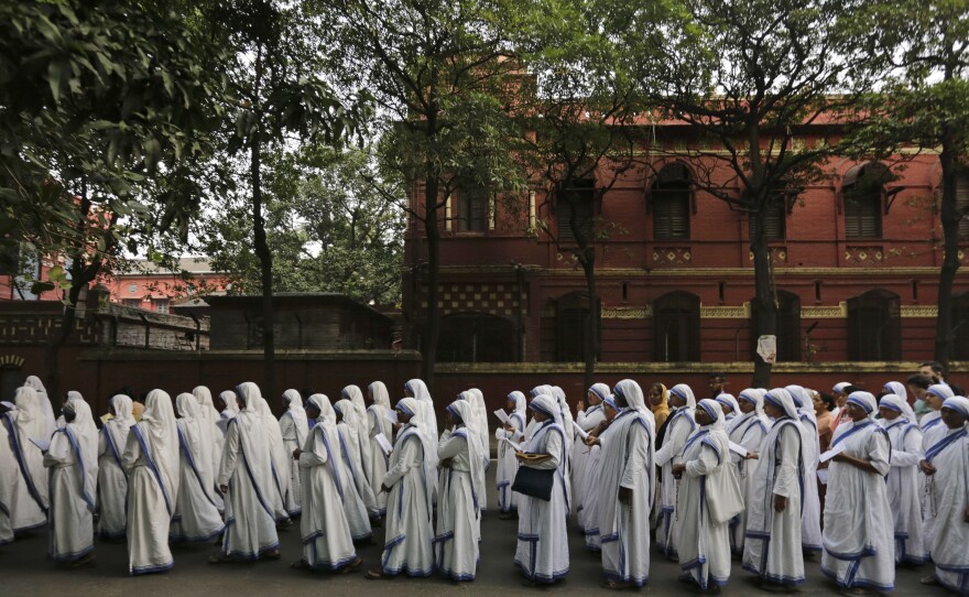 Nuns of the Missionaries of Charity, the order founded by Mother Teresa, who was canonized two years ago, walk in annual Corpus Christi procession organized on the Feast of Christ the King in Kolkata, India, in 2016.