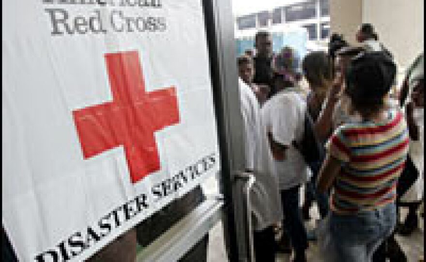 Refugees from New Orleans head into a Red Cross shelter in Baton Rouge, La., in the days after Hurricane Katrina. The Red Cross is trying to improve its disaster-preparedness following criticism of its response to Hurricane Katrina.