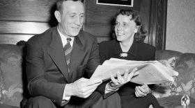 John Wooden sits with his wife, Nell, in 1948. The UCLA coach known as the Wizard of Westwood has died.