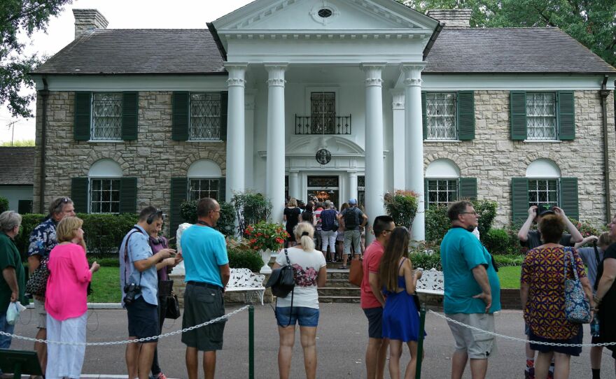 Visitors line up to enter the Graceland mansion in 2017, 40 years after Elvis' death.