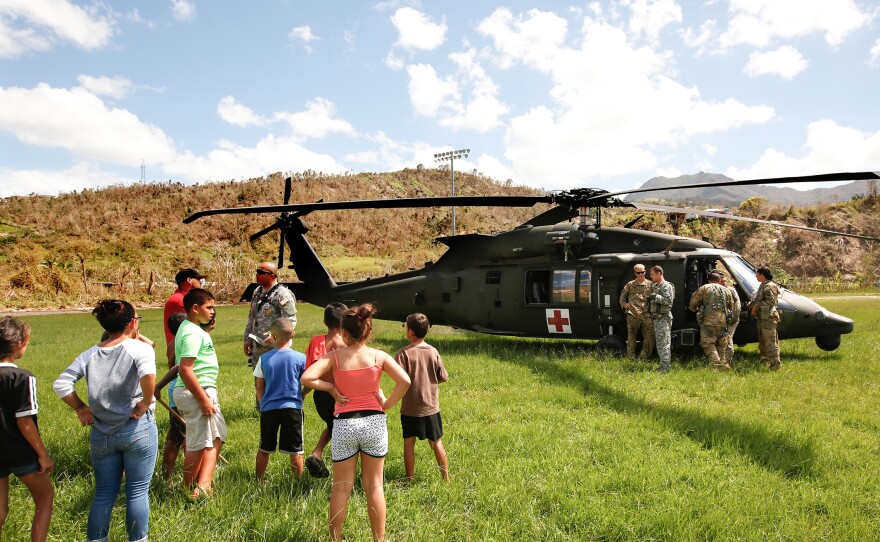 In the mountain town of Juyaya, Puerto Rico, last October, children watched as U.S. Army helicopters brought a team of physicians to assess the medical needs of the local hospital and residents. Going forward, health economists say, the U.S. territory will need continued federal help to deal with its overwhelming Medicaid expenses.
