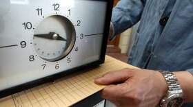 Punching a time card: It's still one way of tracking hours worked. President Obama believes more workers need to be able to add overtime to their pay.

